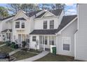 A townhome featuring mixed siding, front lawn and convenient parking at 5915 Trent Walk Dr, Lithonia, GA 30038