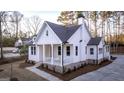 Beautiful two-story home featuring a welcoming front porch and professional landscaping at 5167 Martin St, Covington, GA 30014
