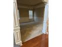 Elegant dining room with classic trim, plush carpet, and a charming chandelier fixture at 1186 Diamond Xing, Mcdonough, GA 30252