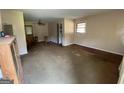 Spacious living room with carpet flooring, ceiling fan, and natural light at 439 Oakside Sw Dr, Atlanta, GA 30331