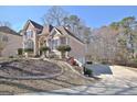 Charming two-story home features manicured landscaping, offering a blend of comfort and curb appeal at 123 Fielding Rdg, Peachtree City, GA 30269