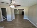Inviting living room showcasing an open layout and wood-look floors, with views into the kitchen area at 3859 Rosedale Ln, Douglasville, GA 30135