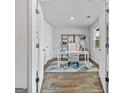 Bright flex room featuring wood floors and neutral decor, perfect for a home office at 1653 Sungrown Way, Mcdonough, GA 30253