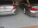 Spacious two car garage with speckled floor and parking for two vehicles at 3223 Thornecreek Dr, Douglasville, GA 30135
