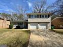 Charming home with a well-manicured lawn and a two-car garage at 2270 Titan Ridge Dr, Decatur, GA 30035