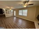 Spacious living room features hardwood floors, ample natural light, and a ceiling fan at 2270 Titan Ridge Dr, Decatur, GA 30035