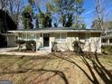 Single-story home with a tidy front yard and neutral-colored exterior at 2804 Mitchell Dr, Decatur, GA 30032