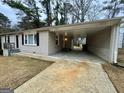 This home features a convenient attached covered carport with a spacious driveway at 645 Steve Sw Dr, Atlanta, GA 30315