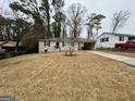 Charming single-story home featuring a well-maintained lawn and covered carport at 645 Steve Sw Dr, Atlanta, GA 30315