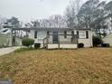 Traditional single-story home with a covered entry and mature landscaping at 836 Amber Nw Pl, Atlanta, GA 30331