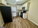 Modern kitchen featuring stainless steel appliances and ample cabinet space at 836 Amber Nw Pl, Atlanta, GA 30331