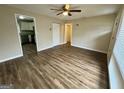 Bright living room with hardwood floors, neutral walls, and a ceiling fan at 836 Amber Nw Pl, Atlanta, GA 30331