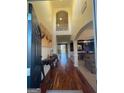 Grand two-story foyer with hardwood floors, elegant console table, and an arched doorway at 2618 Hooch Ct, Duluth, GA 30097