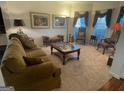 Cozy living room with comfortable seating, carpet, and decorative touches at 2618 Hooch Ct, Duluth, GA 30097