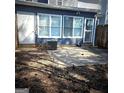 Backyard features concrete patio and mature trees at 8053 Woodlake Dr, Riverdale, GA 30274