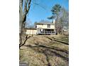 Large backyard with a spacious deck, perfect for outdoor entertaining and relaxation at 230 Mapledale Trl, Sharpsburg, GA 30277