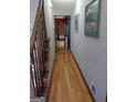 Hallway features hardwood floors with a view into the home at 230 Mapledale Trl, Sharpsburg, GA 30277