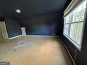Spacious bedroom featuring black walls, large windows, and ample natural light at 1241 Mount Vernon Dr, Lawrenceville, GA 30044
