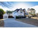 Spacious two-story home featuring an attached garage and a detached garage at 45 George Wynn Rd, Palmetto, GA 30268