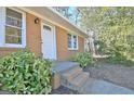 Close-up of the front entrance featuring a classic white door and brick steps at 940 New Hope Rd, Fayetteville, GA 30214