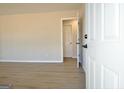 Inviting living room featuring sleek flooring and a doorway to adjacent room at 940 New Hope Rd, Fayetteville, GA 30214