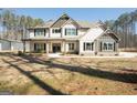 Charming two-story home featuring a welcoming front porch and classic architectural details at 337 Paynes Lake Rd, Carrollton, GA 30116