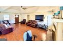 Spacious living room featuring wood floors, crown molding, and fireplace at 2768 Southpark Sw Blvd, Conyers, GA 30094