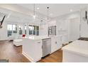 Bright kitchen featuring a large island, stainless steel appliances, and an open floor plan at 118 Via Roma, Woodstock, GA 30188