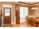 Elegant dining room featuring hardwood floors and a classic chandelier at 104 Summer Chase, Carrollton, GA 30116