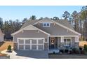 Charming single-story home featuring a two-car garage, covered porch, and neutral siding in a well-maintained community at 645 Timberbrook Dr, Sharpsburg, GA 30277