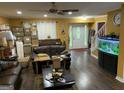 Inviting living room with hardwood floors, aquarium, and ample natural light at 281 Timber Laurel Ln, Lawrenceville, GA 30043