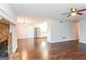 Living room flows to the kitchen, offering hardwood floors and a stone fireplace at 117 Parkway Ct, Dallas, GA 30157