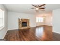 Spacious living room featuring beautiful hardwood floors and a stone fireplace at 117 Parkway Ct, Dallas, GA 30157
