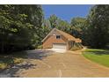 Brick home with a two-car garage and spacious driveway at 170 Majesty Ln, Fayetteville, GA 30215