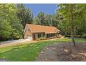 Well-maintained brick home with a two-car garage and landscaped yard at 170 Majesty Ln, Fayetteville, GA 30215