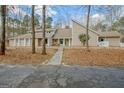 Spacious single story home with light siding, stone accents, and a walkway to the front door at 106 Robinson Bend Trl, Peachtree City, GA 30269
