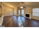 Spacious living room featuring wood floors, fireplace, high ceilings and natural light at 3750 Greenbrook Dr, Douglasville, GA 30135