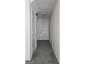 Inviting hallway with plush gray carpet and neutral paint at 905 Pine Tree Trl, South Fulton, GA 30349