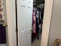 Fully stocked walk-in closet, view from doorway at 24 Picketts Mill Pl, Acworth, GA 30101