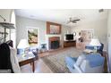 Spacious living room with a brick fireplace and hardwood floors at 1800 Stockton Walk Ln, Snellville, GA 30078