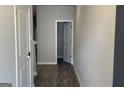 Inviting hallway featuring modern wood floors and neutral paint at 3405 Endurance Ct, South Fulton, GA 30349