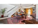 Cozy dining area with a stylish rug, wooden table, and adjacent staircase at 2405 Hillside Ave, Decatur, GA 30032