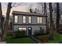Charming two-story home with a welcoming blue door and fresh green lawn at 2405 Hillside Ave, Decatur, GA 30032