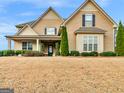 Well-maintained two-story home has great curb appeal and charming architectural details at 108 Donovan Ave, Locust Grove, GA 30248