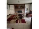 Cozy living room with a fireplace, built-in bookshelves, and a comfortable seating area at 392 Hwy 314, Fayetteville, GA 30214