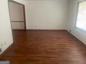 Open living room with gleaming hardwood floors and natural light at 392 N Hwy 314, Fayetteville, GA 30214
