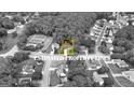 Aerial view of a charming residential neighborhood showcasing the property lines of a beautiful home and lush landscaping at 103 Vintage Trl, Mcdonough, GA 30253