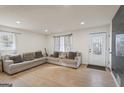 Well-lit living room features laminate floors, recessed lights, and a cozy atmosphere at 2827 Somerton Dr, Morrow, GA 30260
