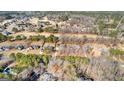Aerial view of neighborhood with golf course and beautiful homes at 1585 Lake Dow Rd, Mcdonough, GA 30252