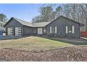 Charming single story home with a two-car garage, double front doors, and minimal landscaping at 203 Hedgewood Ct, Peachtree City, GA 30269